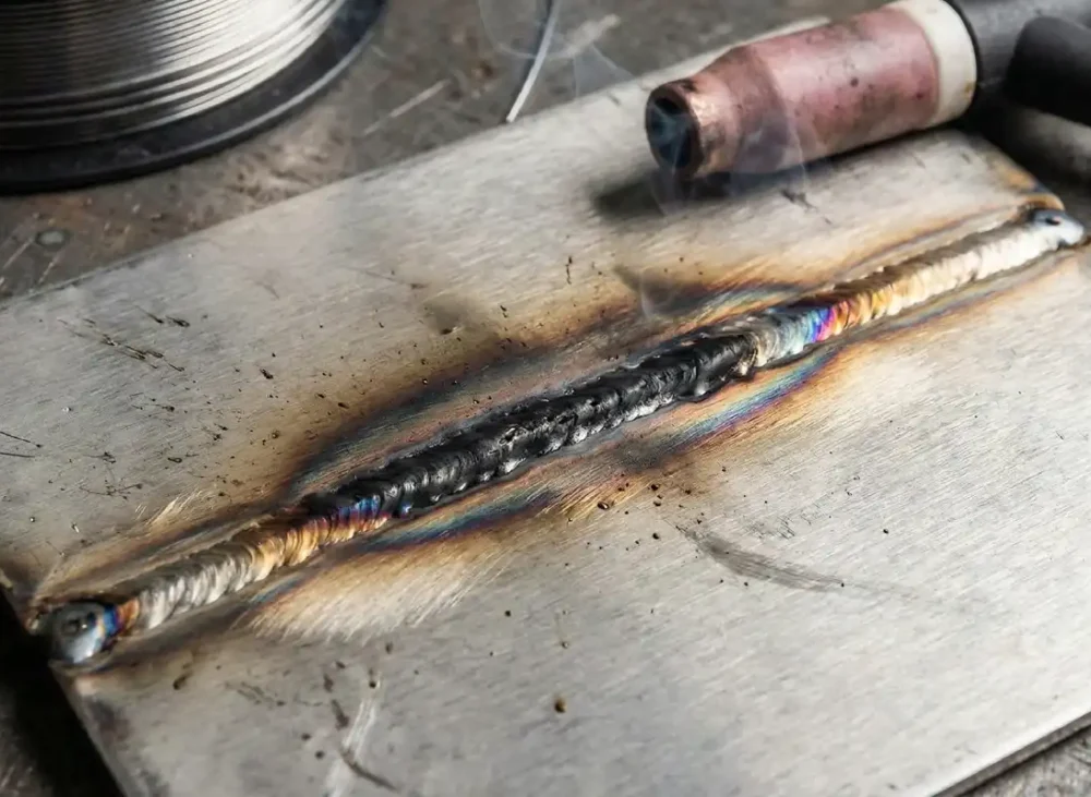 Why do stainless steel weld seams turn black