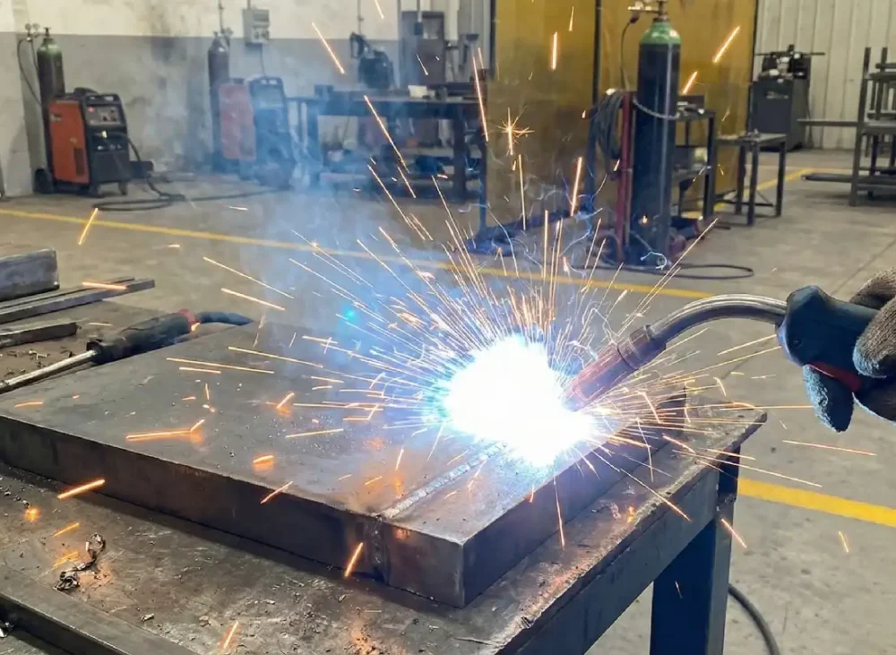 Why does welding aluminum sometimes produce sparks